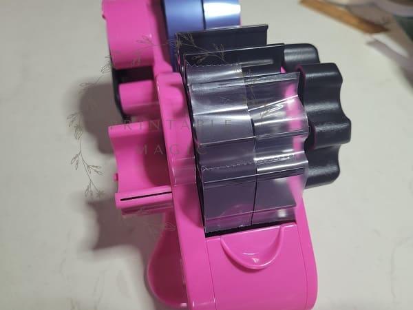 Echomerx heat tape dispenser showing the mutliple cut pieces of tape on the two 3" core wheels ready to use with your project